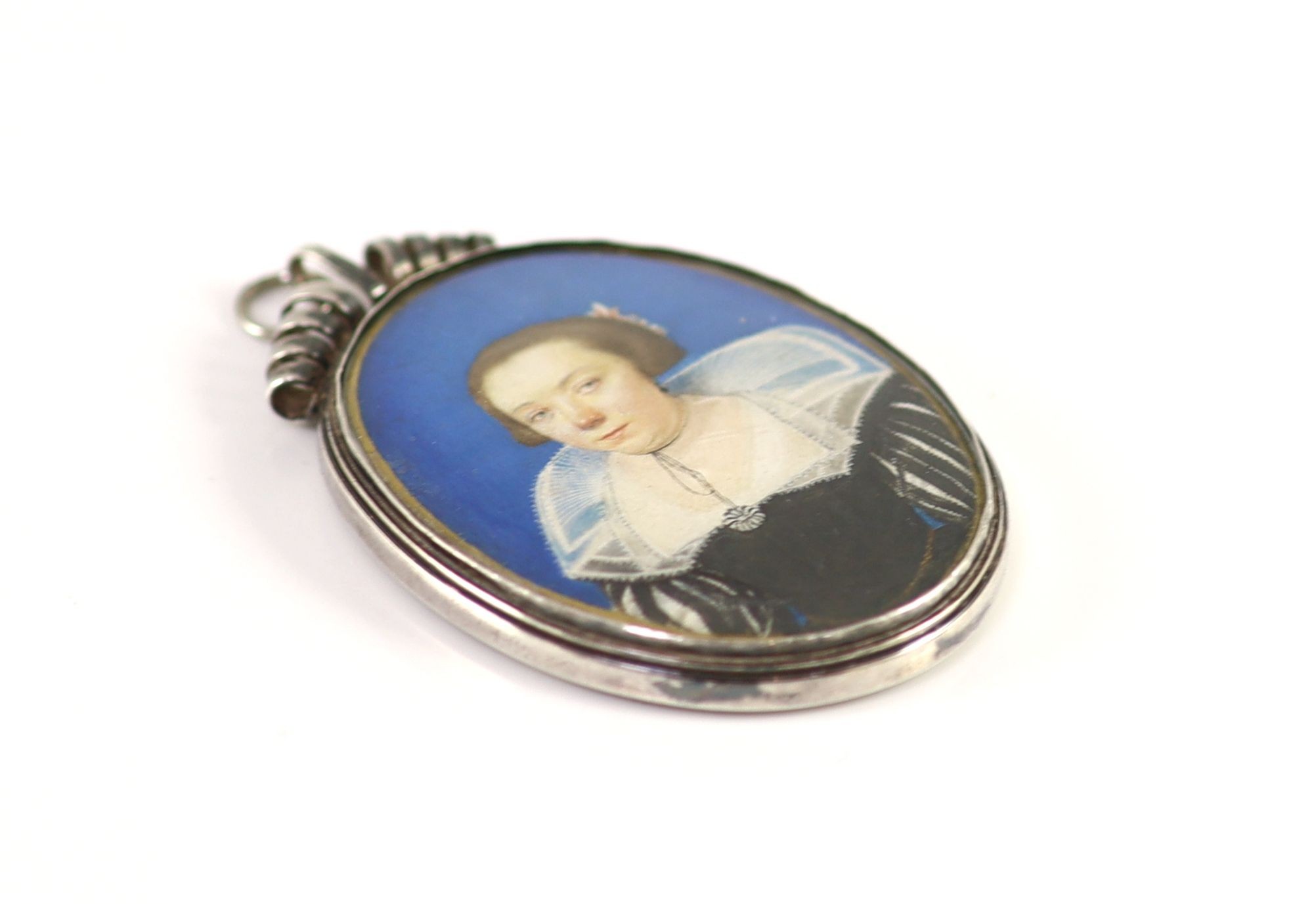 17th century English School , Portrait miniature of a lady wearing a black dress with lace collar and a silver pendant, watercolour on vellum, 5 x 4cm, silver frame